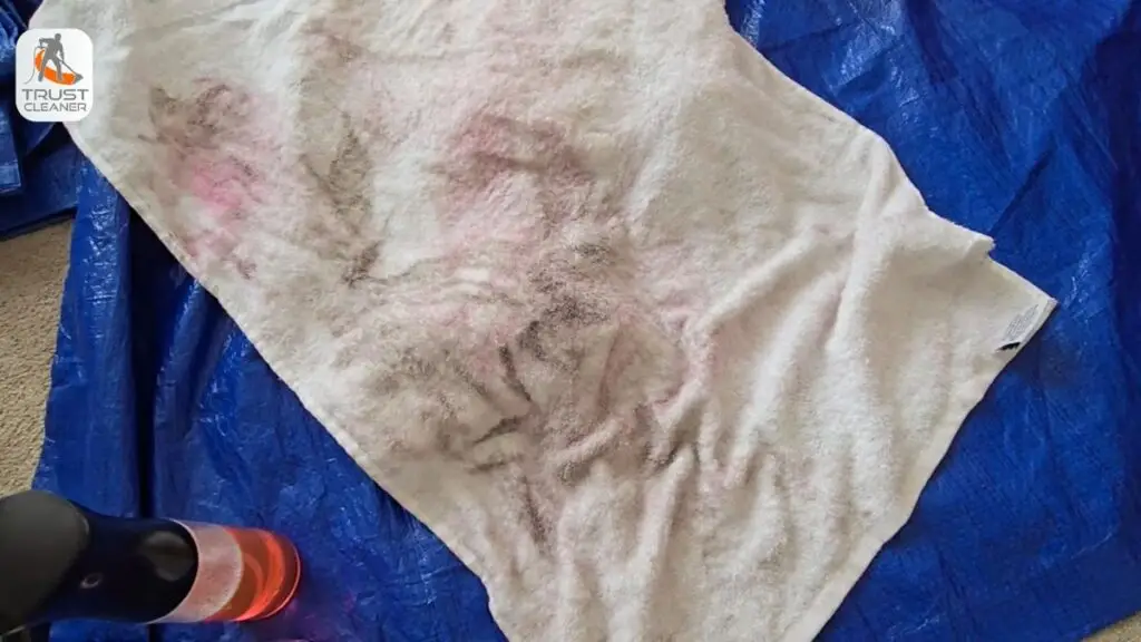 Soil lifted out during cleaning, caught on a white cloth